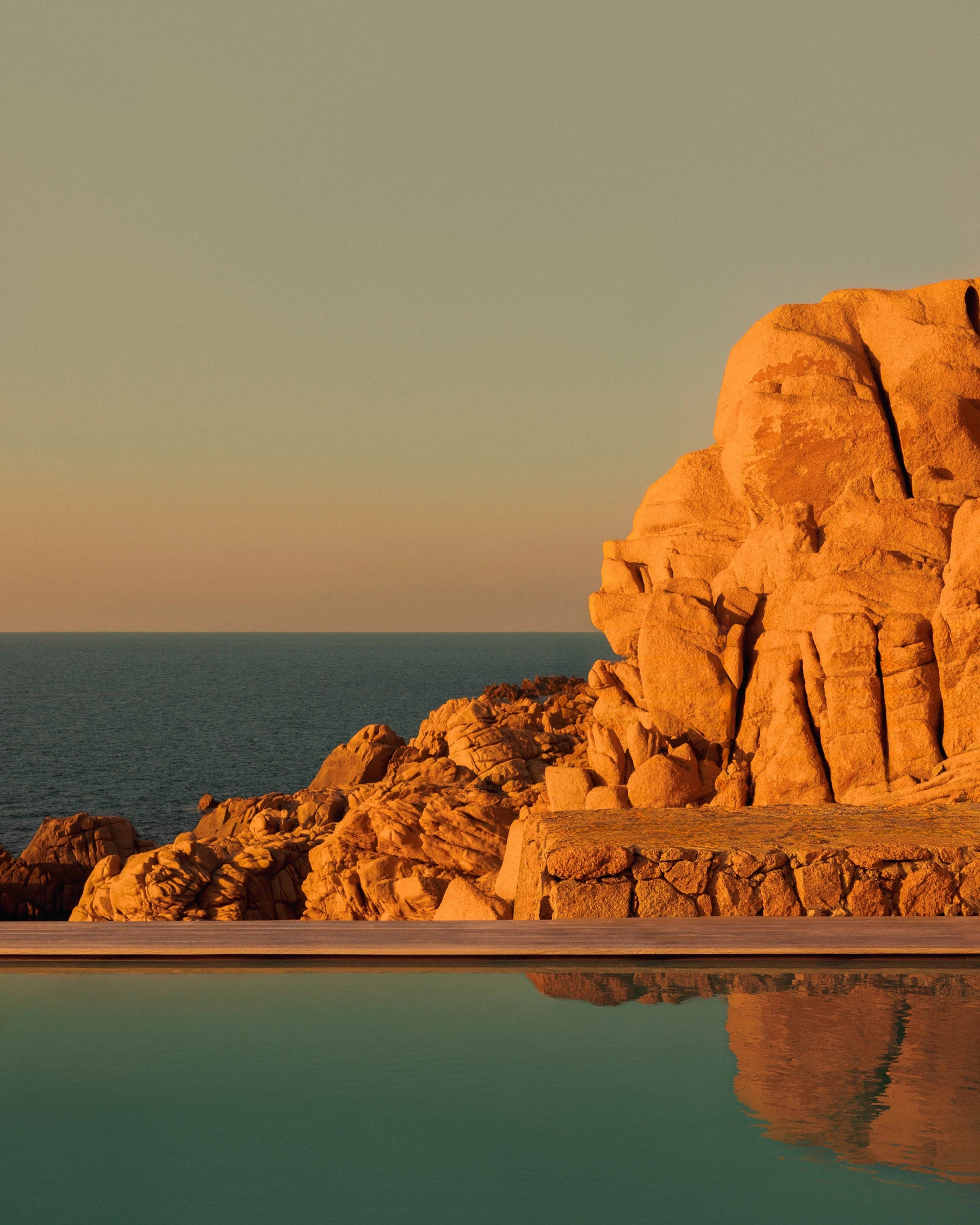 Swimming pool overlooking the granite coastline and Mediterranean Sea at Casa Scalesciani in Costa Paradiso, Sardinia.