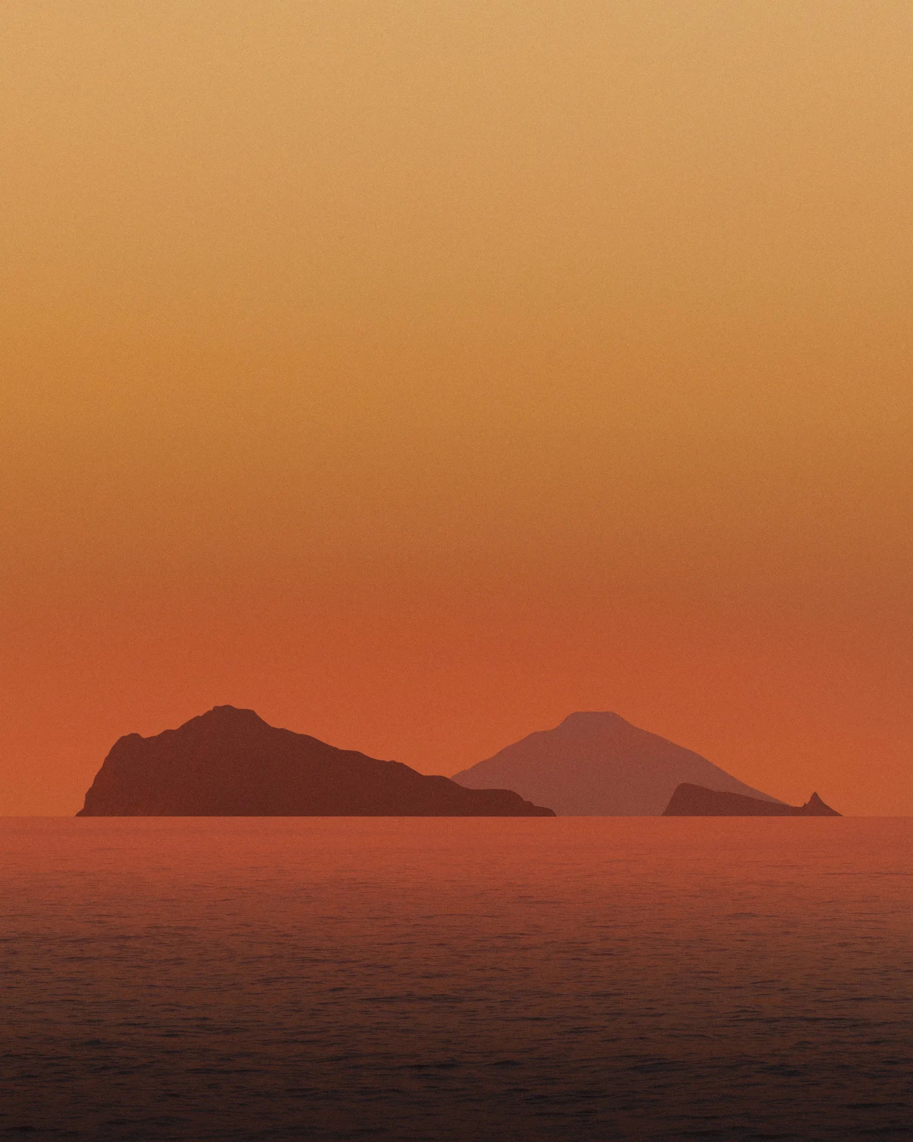 Mediterranean islands at sunset with warm orange sky and calm sea