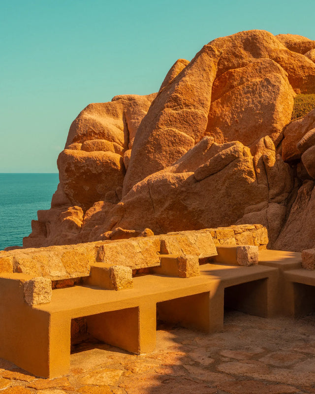 Outdoor stone seating integrated into the granite landscape at Casa Scalesciani.