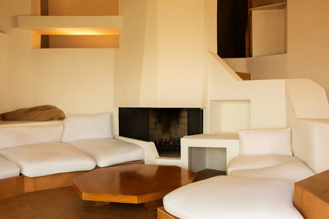 Living room with fireplace inside Casa Scalesciani by Alberto Ponis.