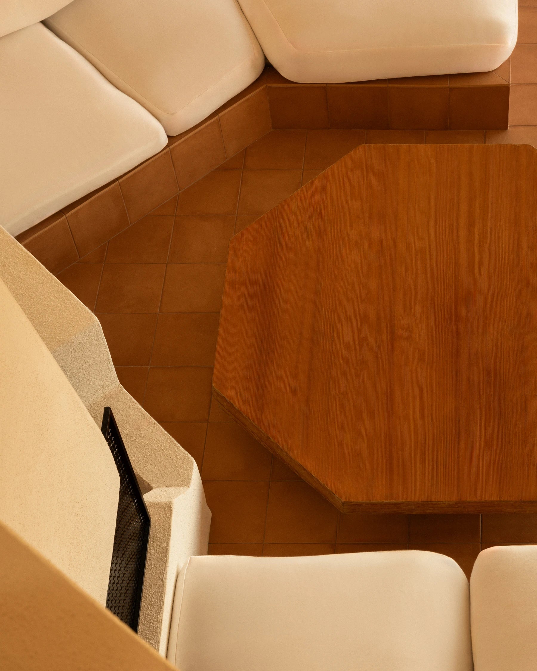 Wooden coffee table and built-in seating inside Casa Scalesciani.
