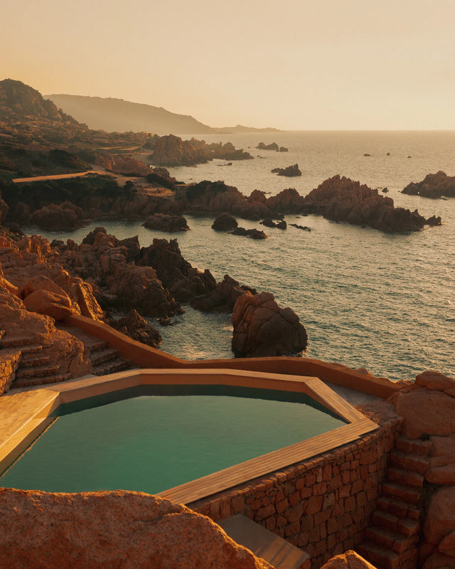 Swimming pool at Casa Scalesciani overlooking the rocky Sardinian coastline.