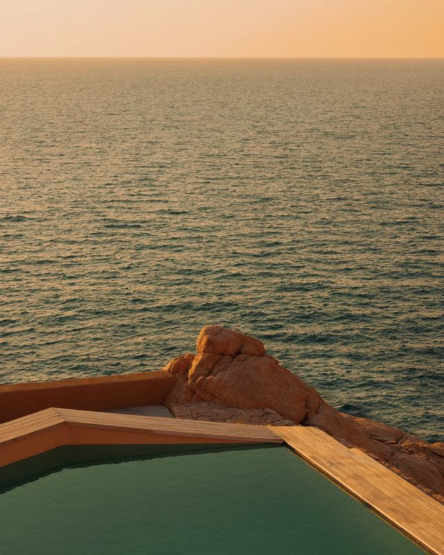 The pool extends the dialogue between architecture and sea.