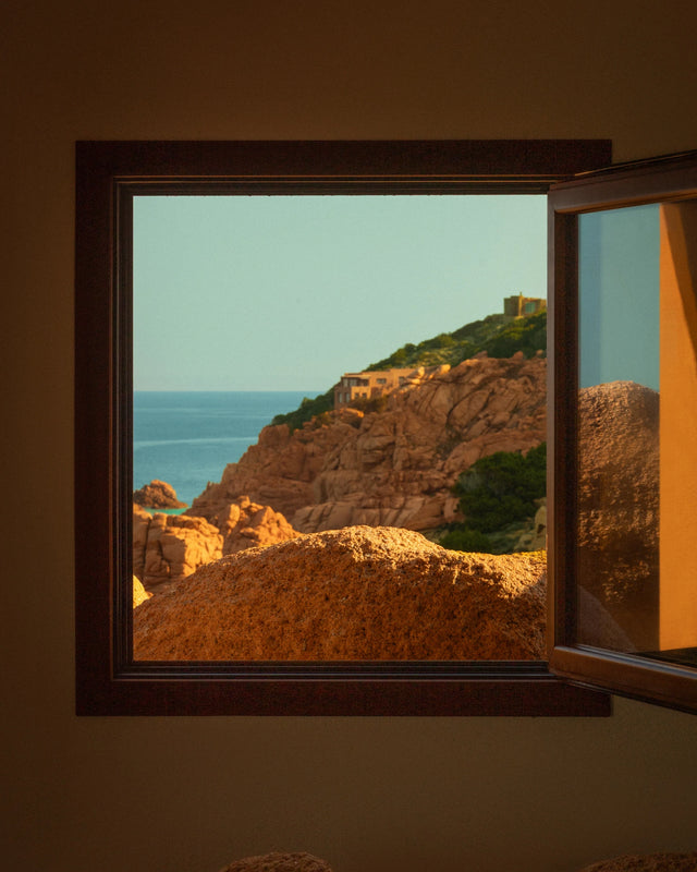 Open window overlooking the Sardinian coastline from Casa Scalesciani.