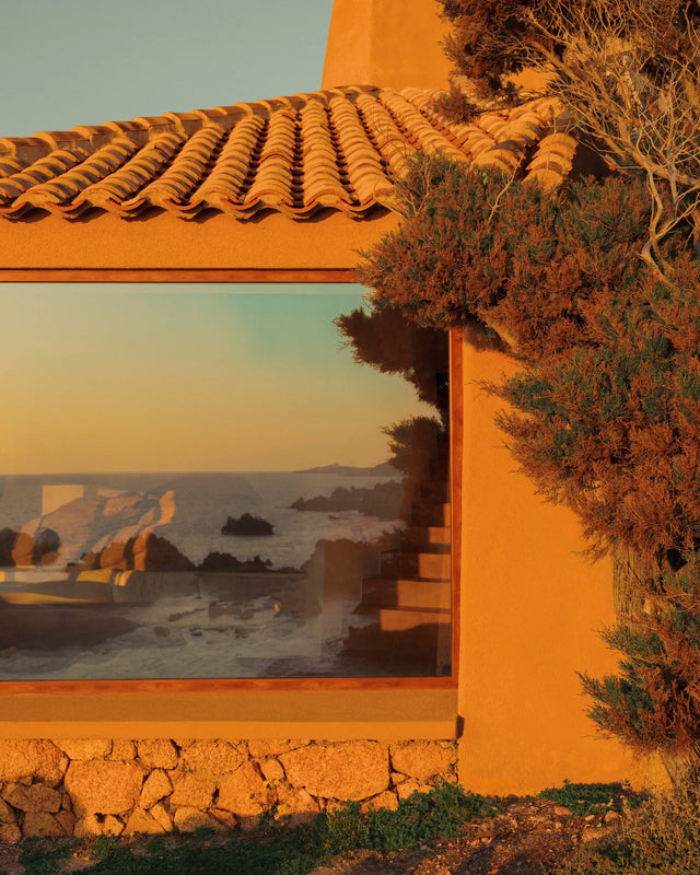 Window reflecting the Mediterranean Sea at Casa Scalesciani by Alberto Ponis in Costa Paradiso, Sardinia.