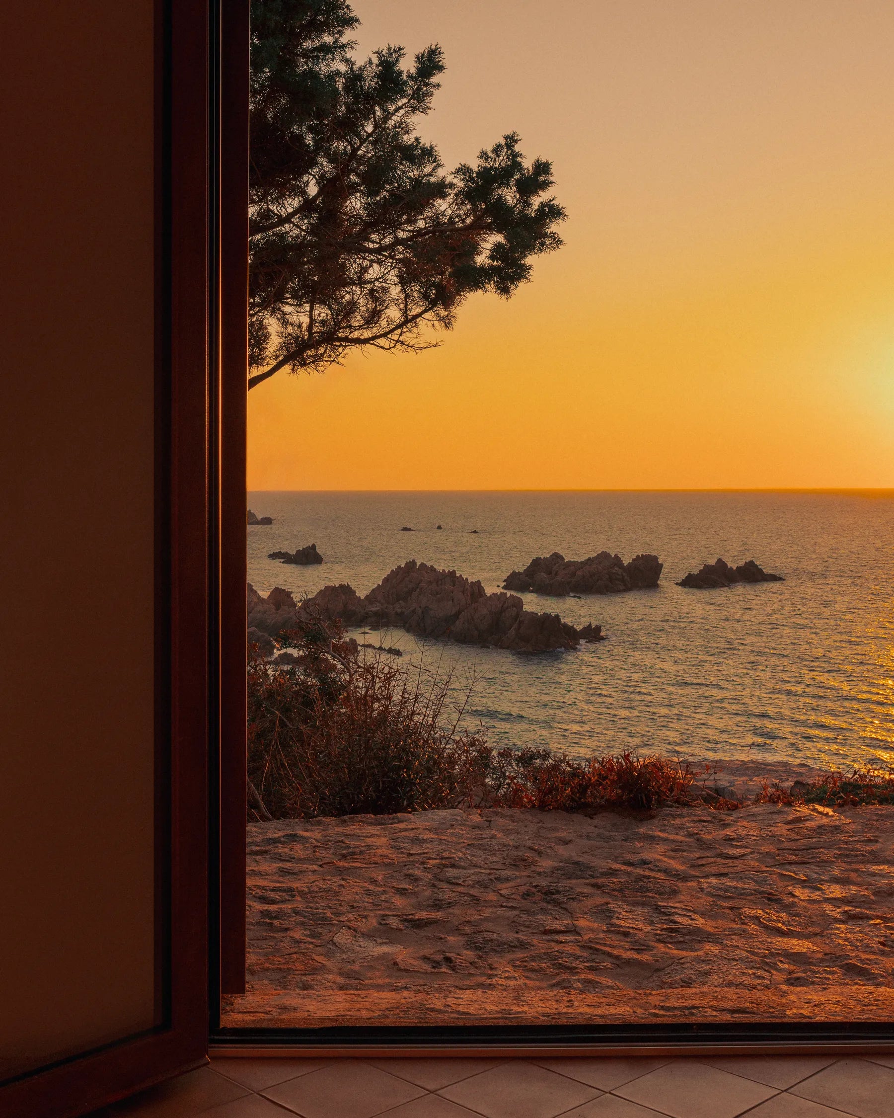 Sunset through an open doorway at Casa Scalesciani designed by Alberto Ponis.