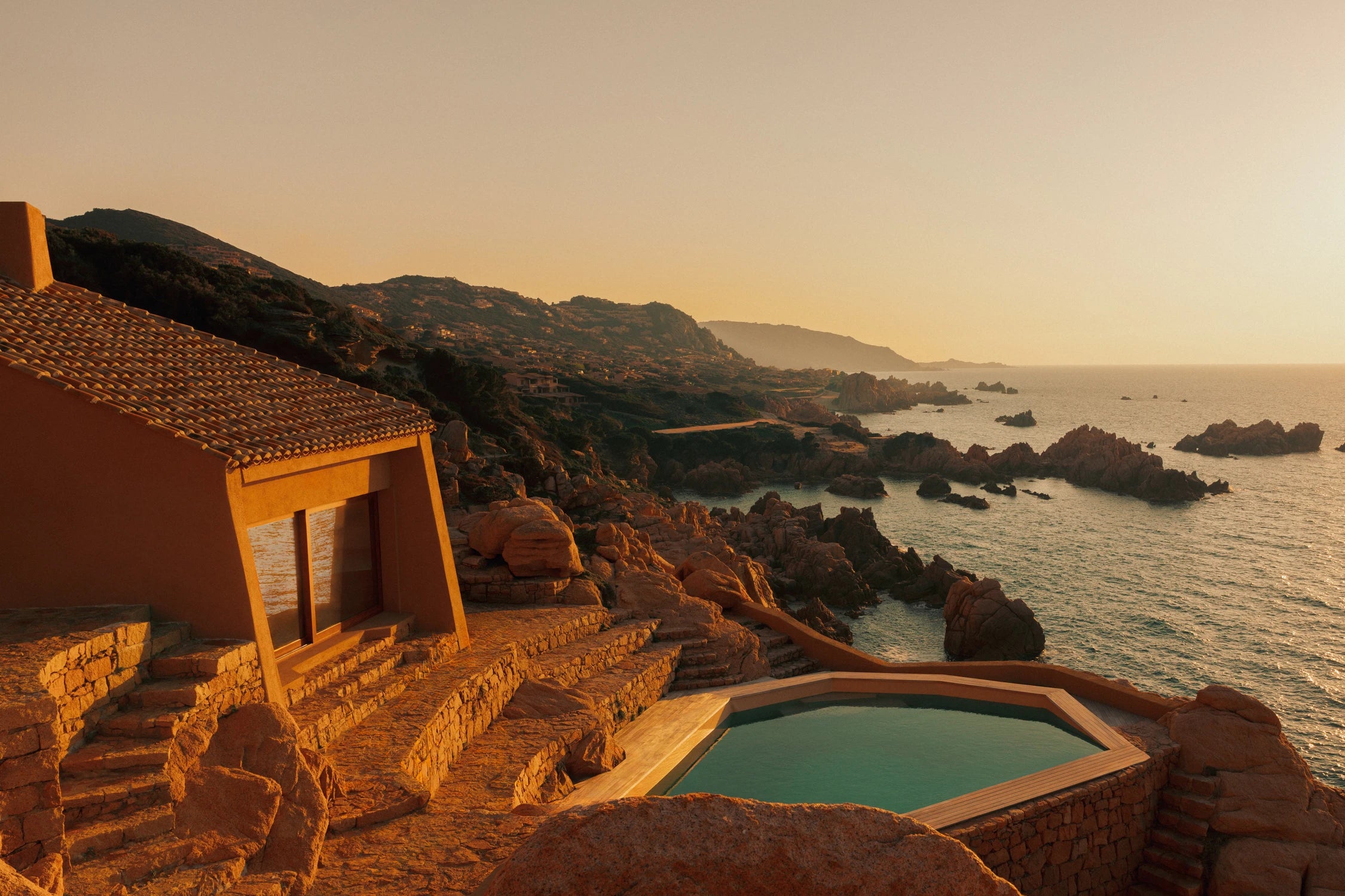 Casa Scalesciani overlooking the Mediterranean Sea in Costa Paradiso, Sardinia, with its swimming pool integrated into the granite coastline.