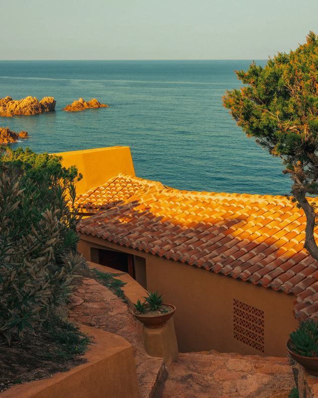 Terracotta roof of Casa Scalesciani with the Mediterranean Sea in the background.