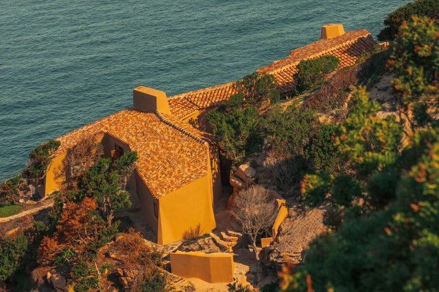 Aerial view of Casa Scalesciani integrated into the granite coastline of Costa Paradiso.