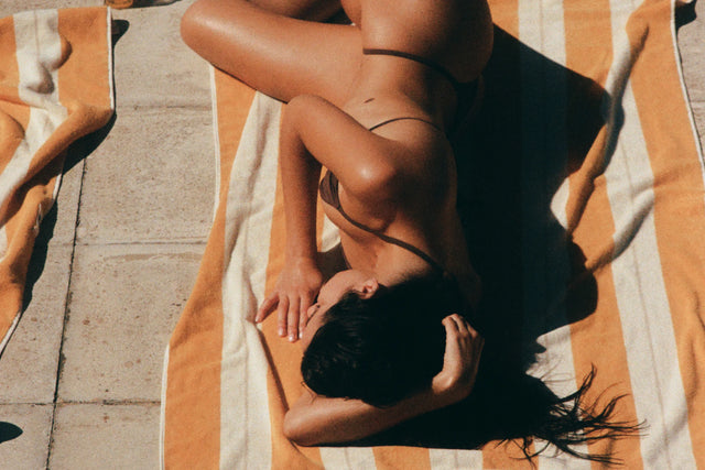 Woman relaxing on the Anne Beach Towel in Tuscan Sun