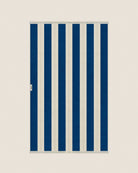 Folded striped Éteanne beach towel tuscan sun and ivory tones showing thickness and softness