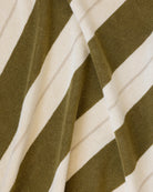 Éteanne beach cotton towel draped in natural folds highlighting texture and absorbency