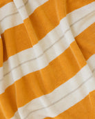 Éteanne beach cotton towel draped in natural folds highlighting texture and absorbency