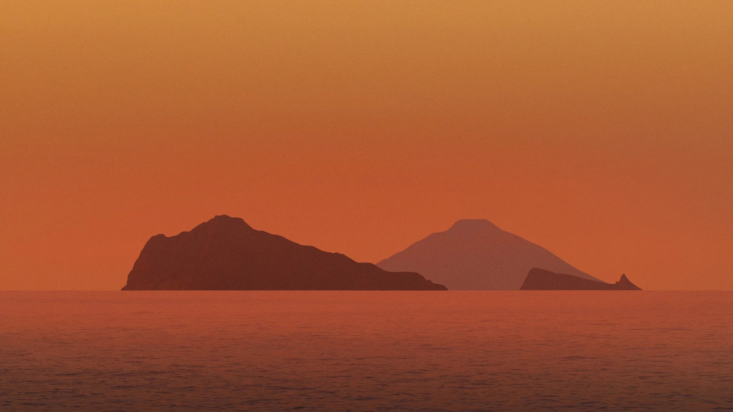Mediterranean islands at sunset with warm orange sky and calm sea